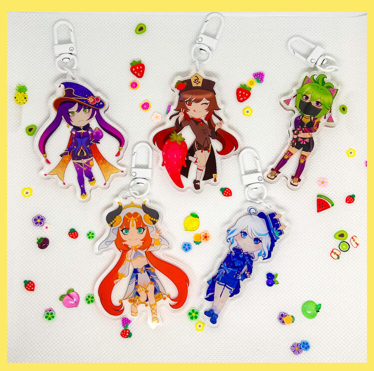Fruit-themed chibi acrylic charms of Hu Tao, Mona, Nilou, Kuki Shinobu, and Furina from Genshin Impact